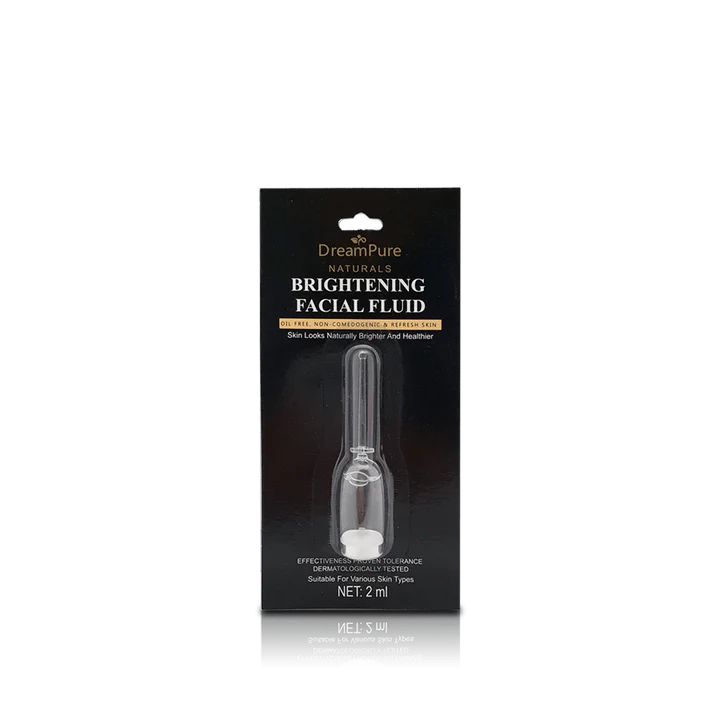 Packaging of DreamPure Naturals Brightening Facial Fluid on a white background