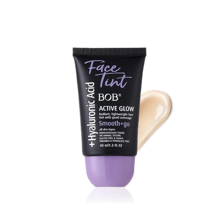 Tube of Face Tint with applicator on a white background
