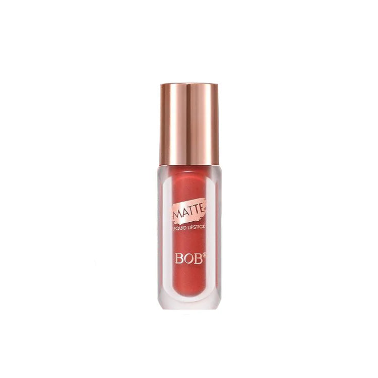 Lipstick with a copper cap on a white background