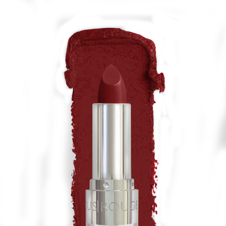 Red lipstick with silver cap on a white background