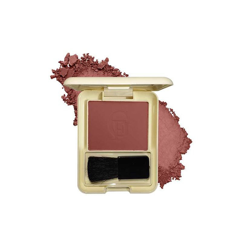 Makeup blush compact with brush and scattered powder on a white background
