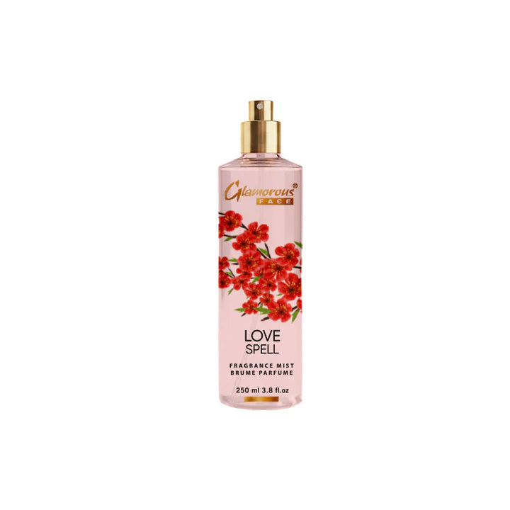 Pink bottle of 'Love Spell' fragrance mist with floral design on a white background