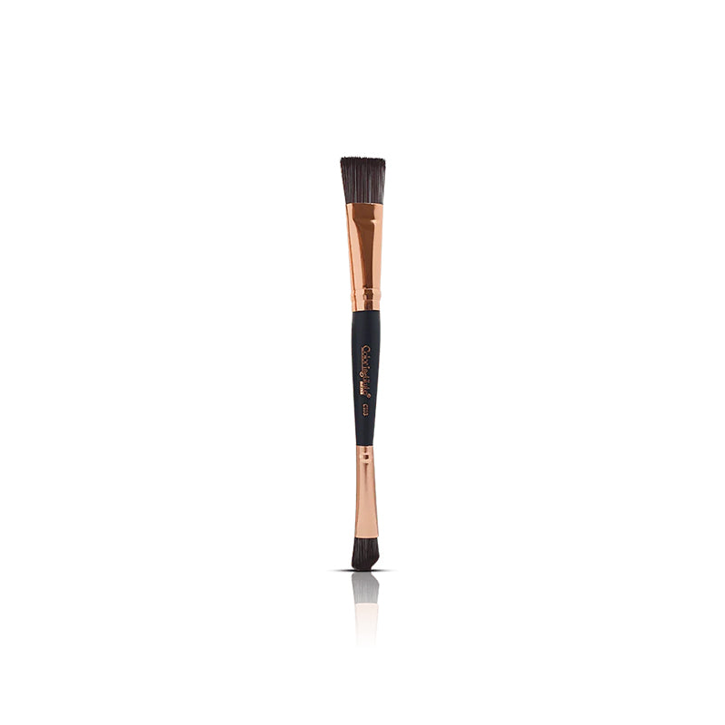 Makeup brush with black and rose gold handle on a white background