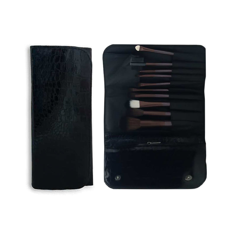 Set of makeup brushes in a black case on a white background