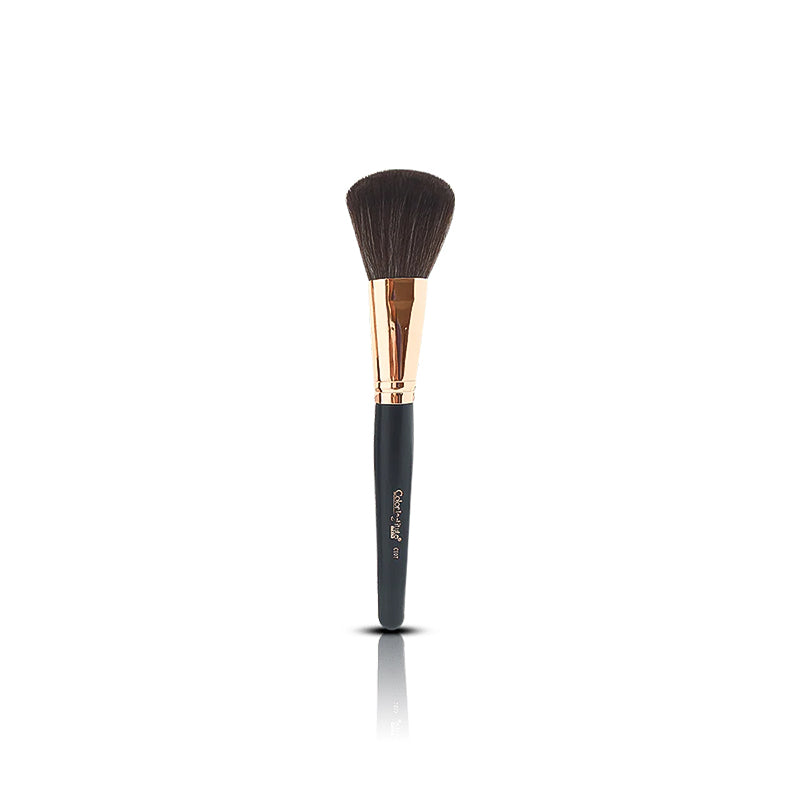 Makeup brush with black bristle head and rose gold ferrule on a white background